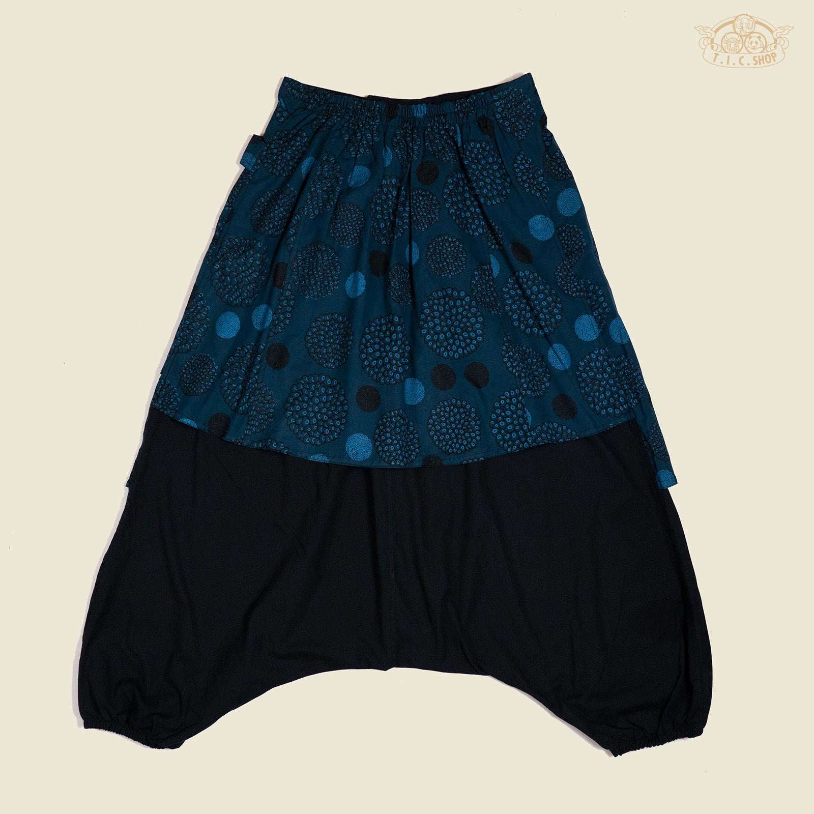 Back view of cotton trousers showing relaxed fit and elastic cuffs.