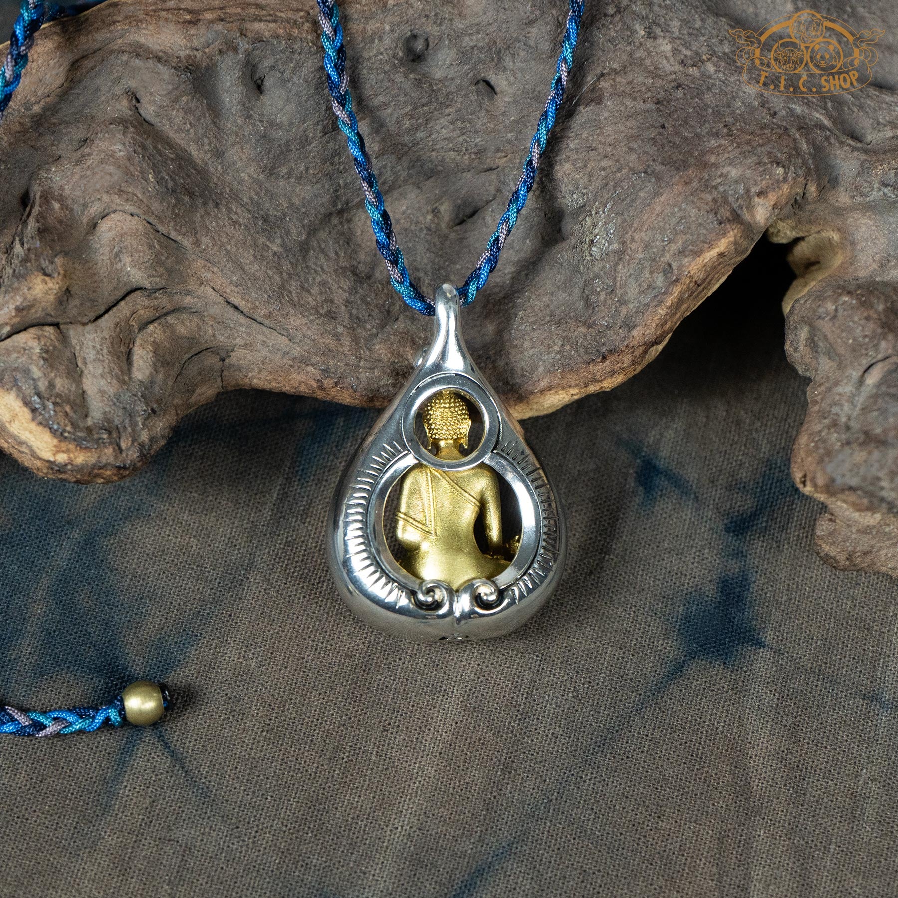 Back view of Medicine Buddha amulet pendant, showing sculpted details and depth