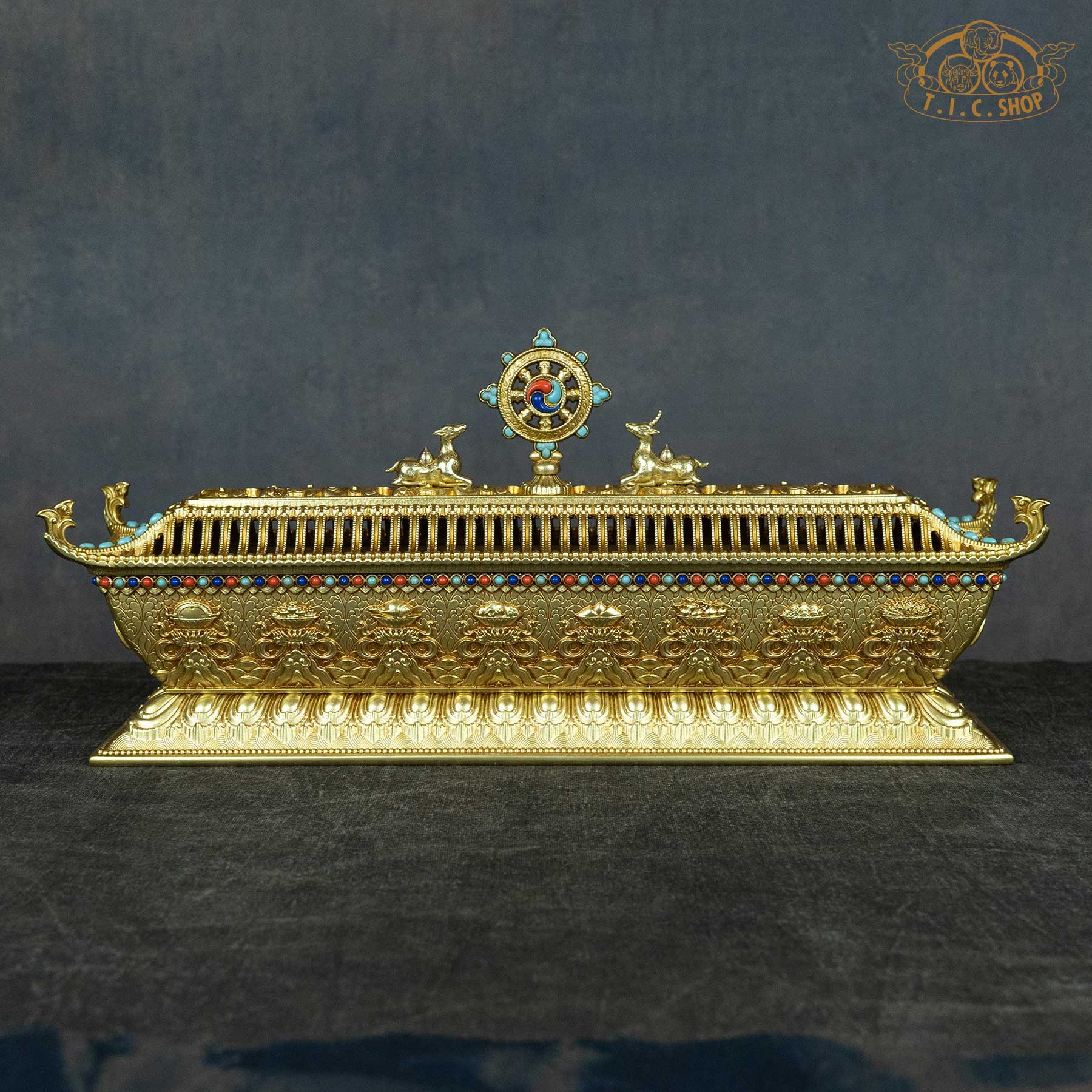 Front view of Pagoda Style Brass Incense Burner with Eight Auspicious Symbols on lotus base, handcrafted Himalayan ritual piece.