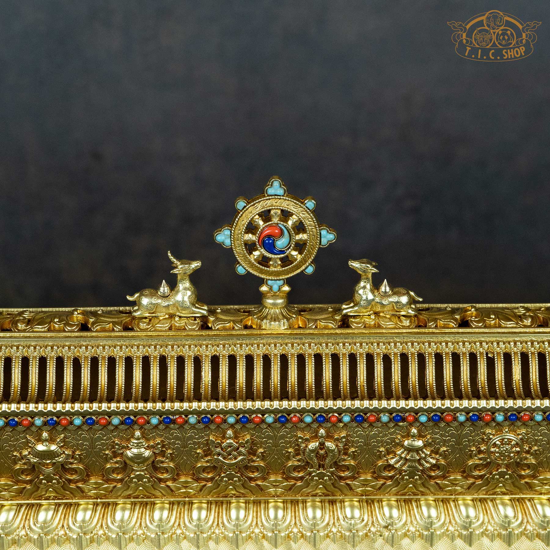 pagoda-style brass incense burner lid with ornate openwork patterns.