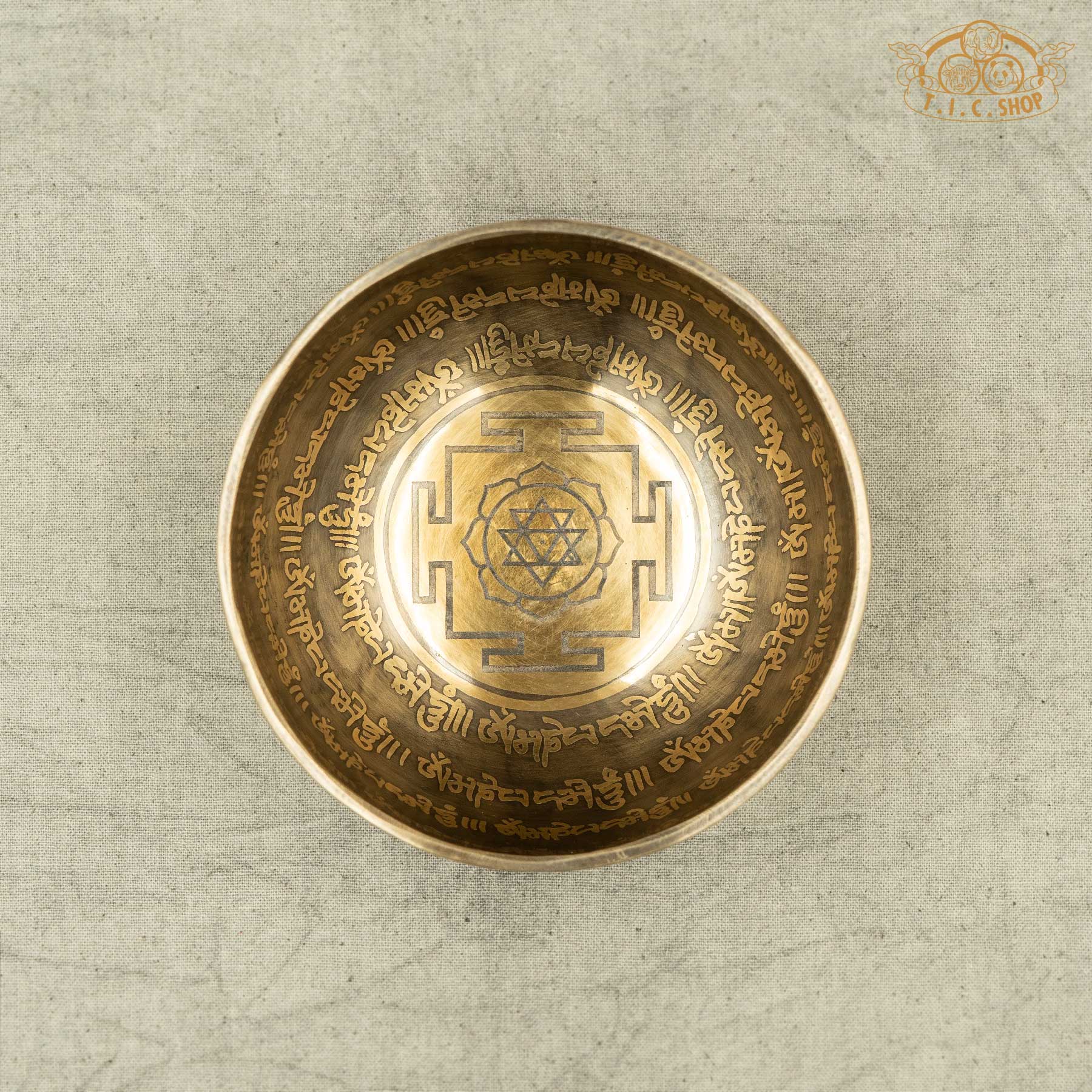 Top view of Handmade Tibetan singing bowl from Nepal with carved OM MANI PADME HUN mantra and Mandala pattern for meditation and healing