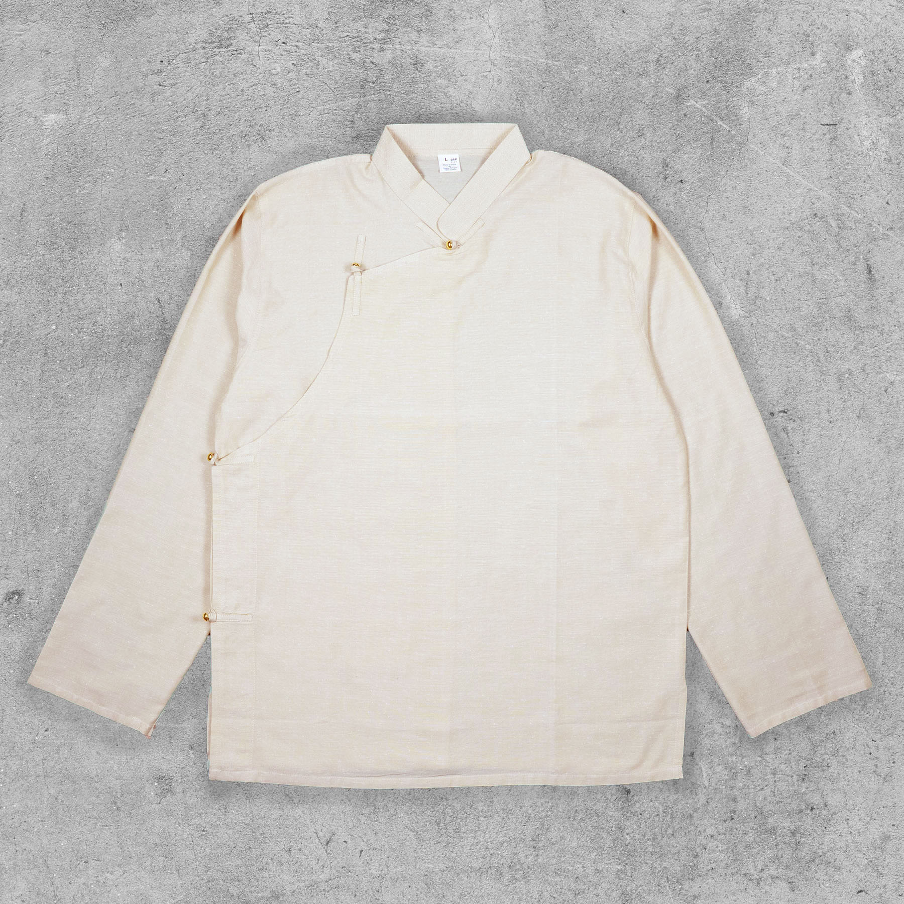 Front view of Tibetan-style cotton shirt in natural color, showcasing its traditional design and cut.