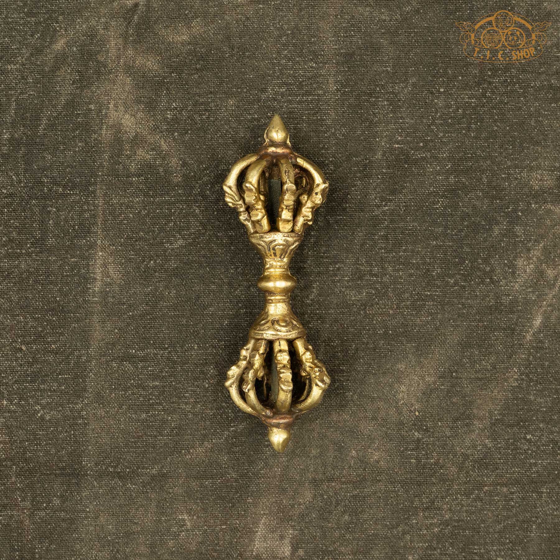 Handmade Himalayan brass Nine-Pronged Vajra Dorje used in Tibetan Buddhist altar offerings

