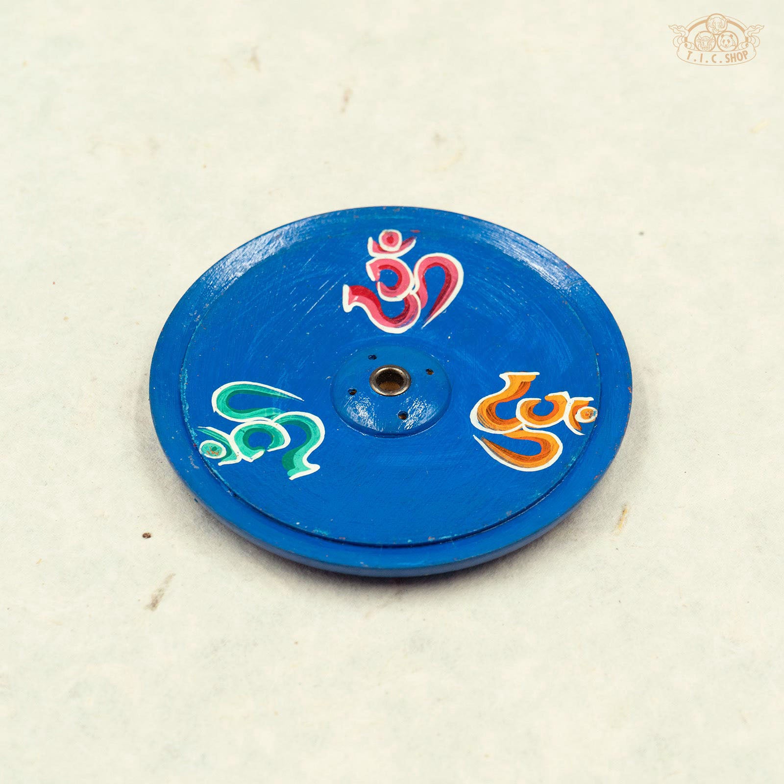 Tibetan wooden incense holder hand-painted with OM symbols.