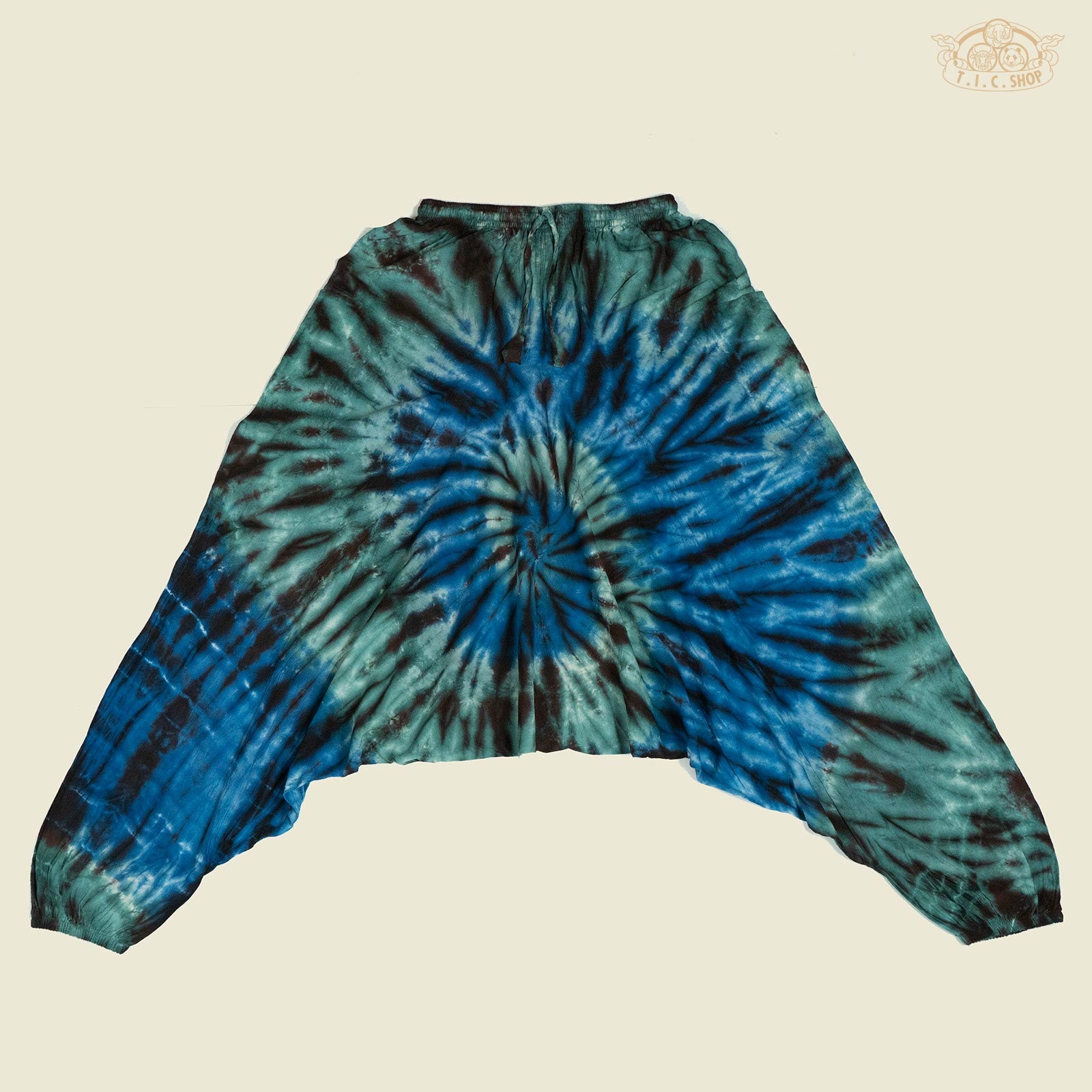 Front view of tie-dye cotton yoga trousers with elastic waistband and side pockets.