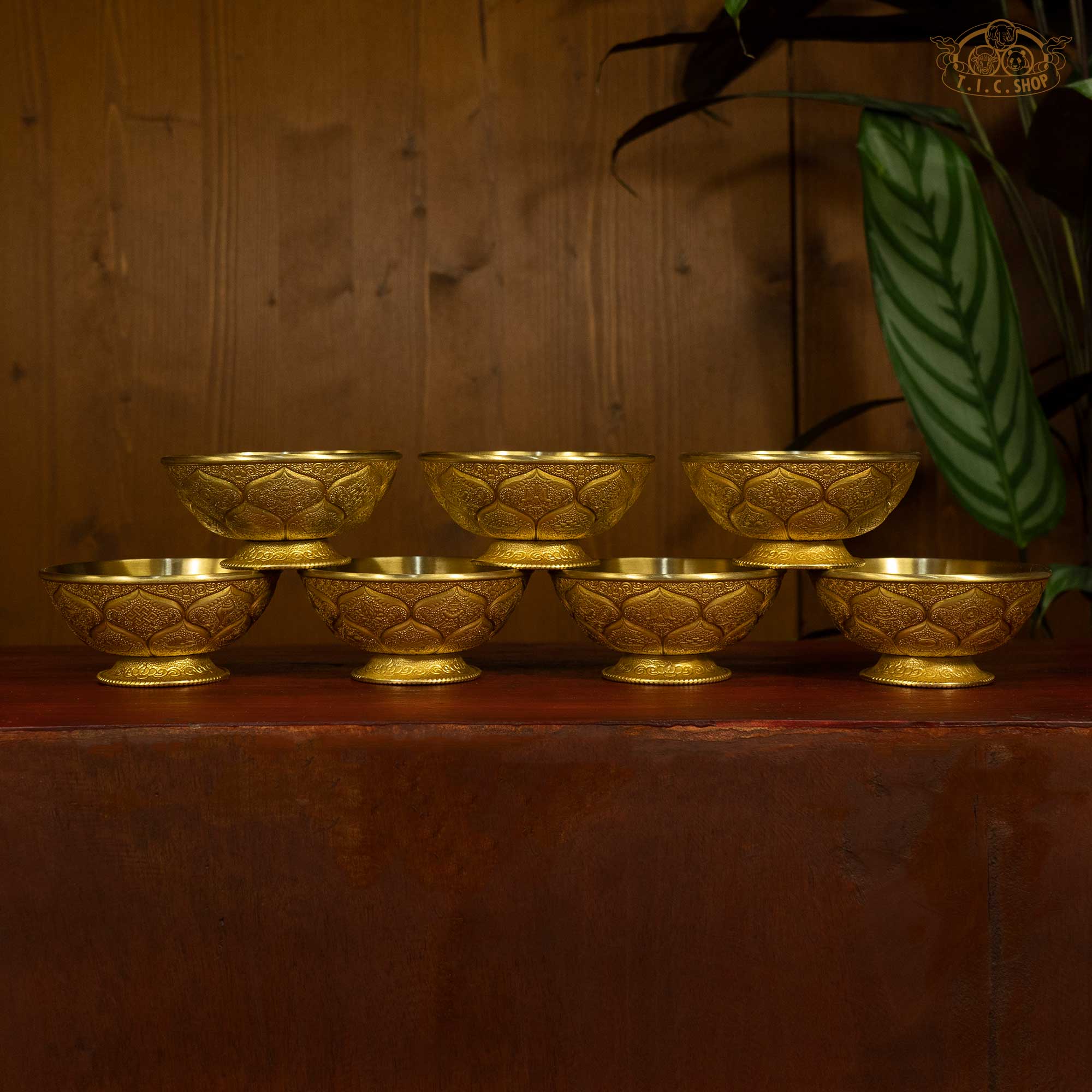 Tibetan brass offering bowl set with traditional decorative patterns