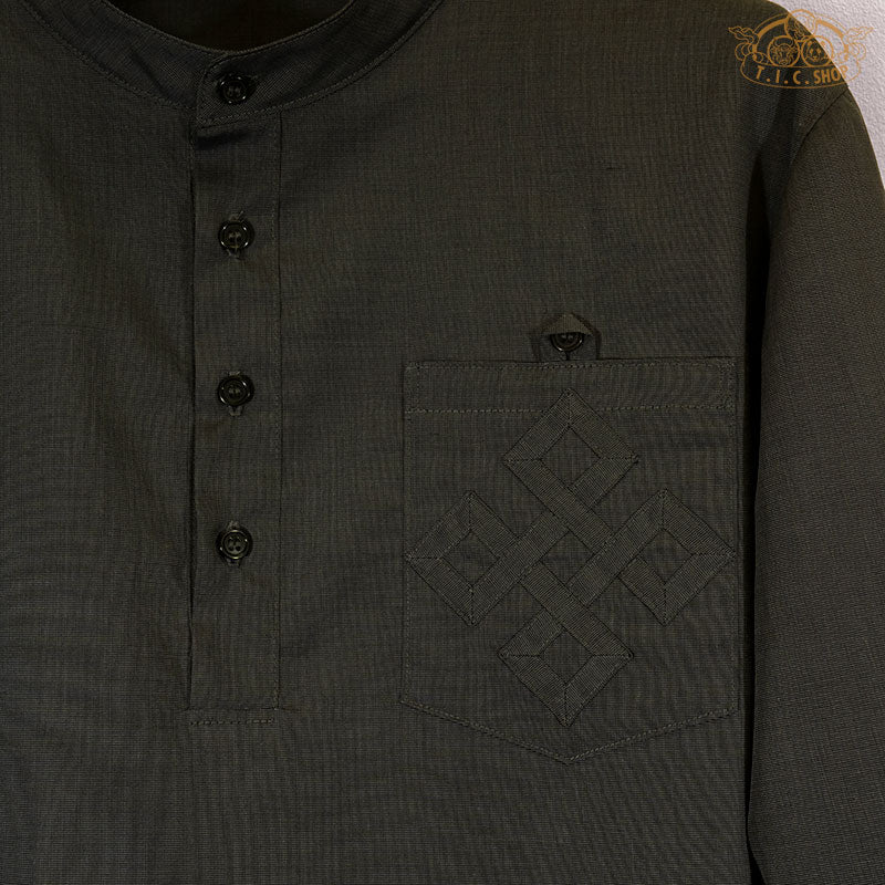Close-up of the hand-embroidered Endless pattern on Himalayan shirt.

