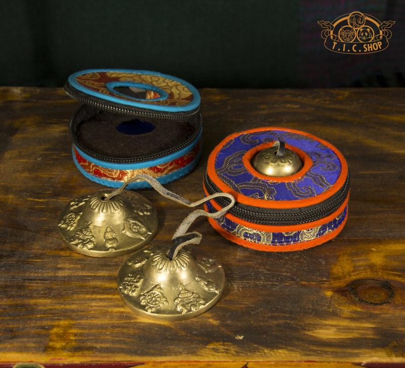 Front view of handmade Tibetan brocade Tingsha bell case in colorful traditional patterns.