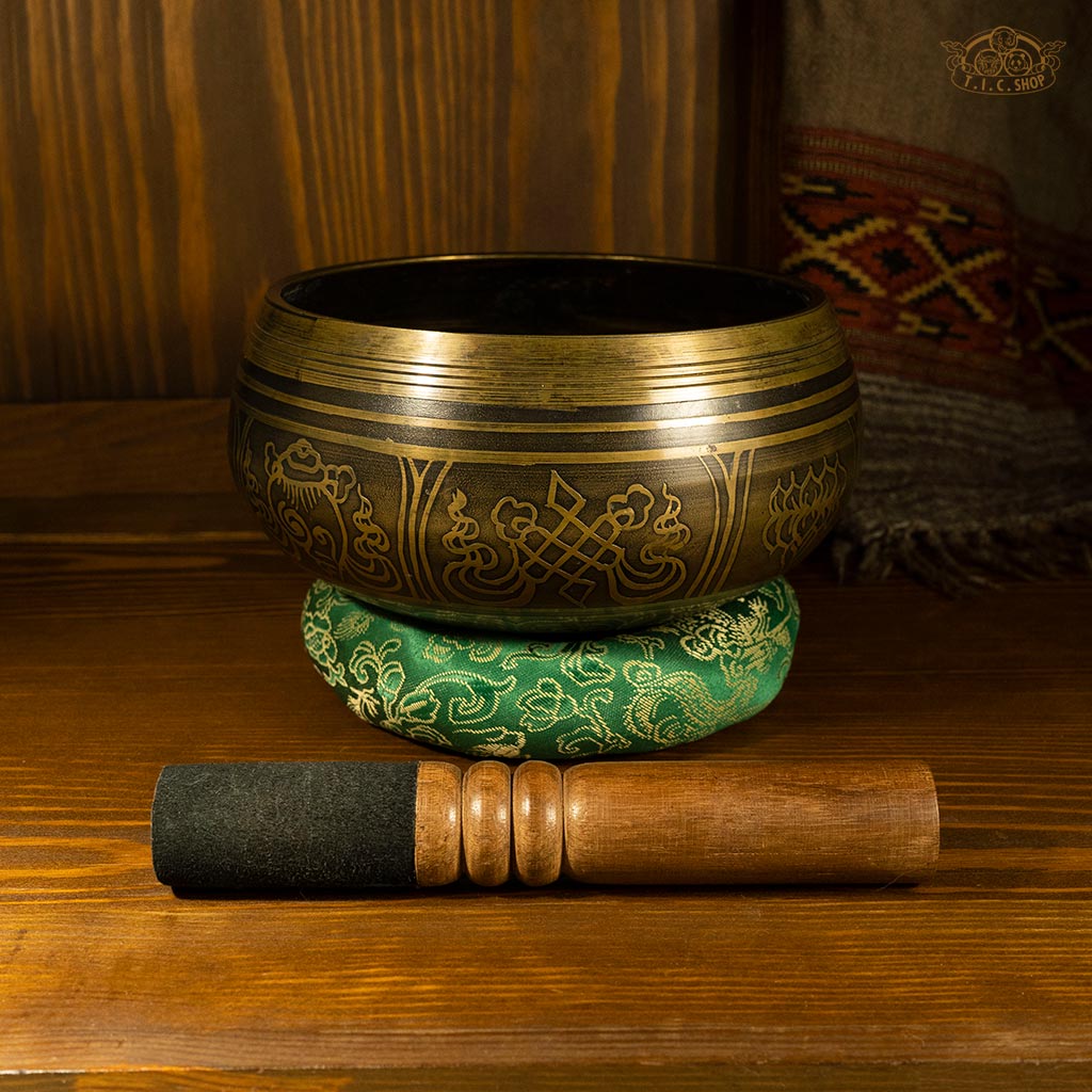 Side view of the brass Tibetan singing bowl, displaying its depth and shape.