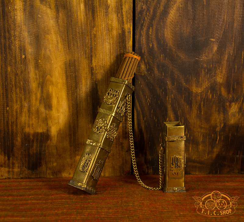 Open Tibetan brass incense case showing removable lid and inner compartment for storing incense sticks.