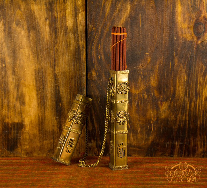 This Tibetan brass incense case showing removable lid and inner compartment for storing incense sticks.