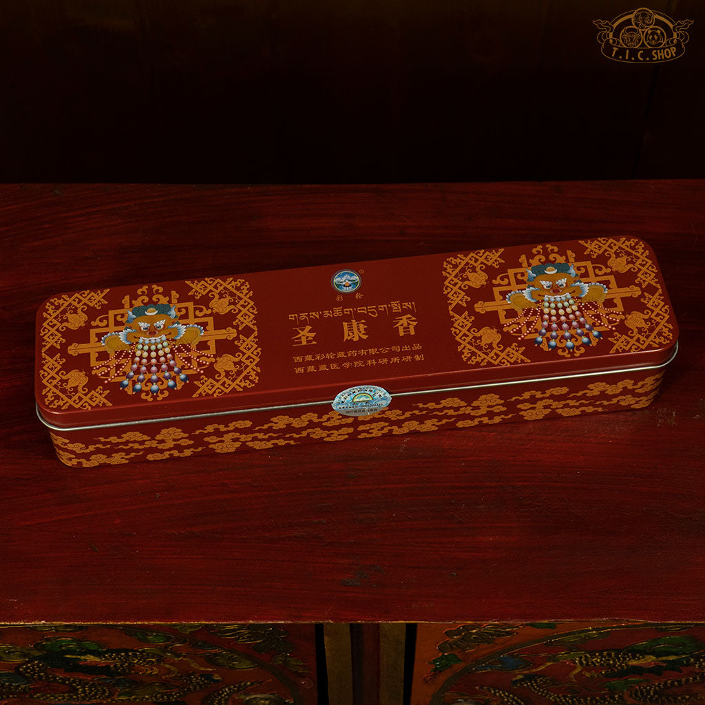 A metal box with decorative patterns, Holy Land Tibetan incense with agarwood, sandalwood, and herbs for Buddhist offering and purificat.