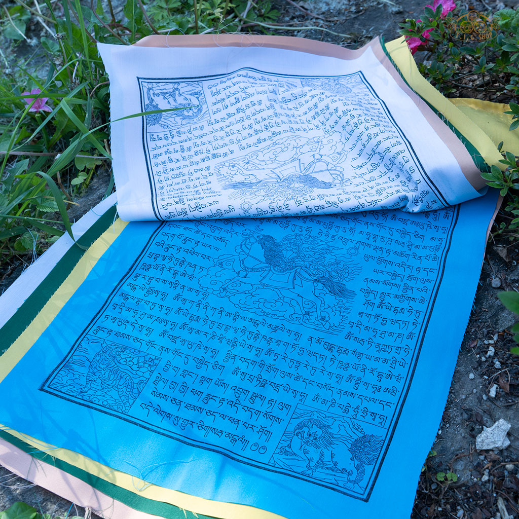 Close-up of colorful cotton Tibetan Windhorse prayer flag featuring traditional symbols for luck and protection