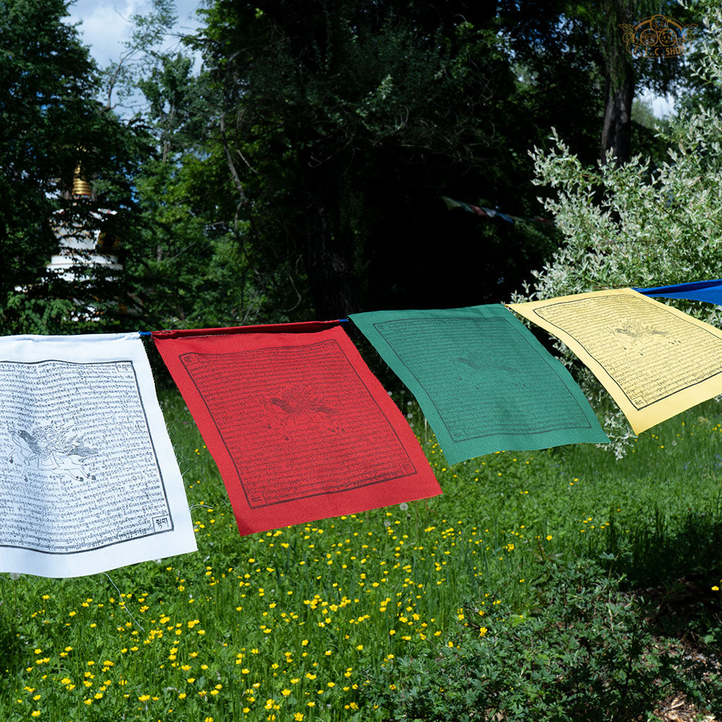 Outdoor hanging of Tibetan Windhorse prayer flags made from cotton, enhancing spiritual atmosphere