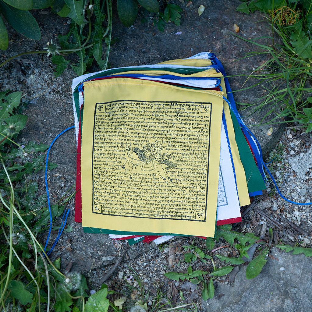 Close-up of colorful cotton Tibetan Windhorse prayer flag featuring traditional symbols for luck and protection
