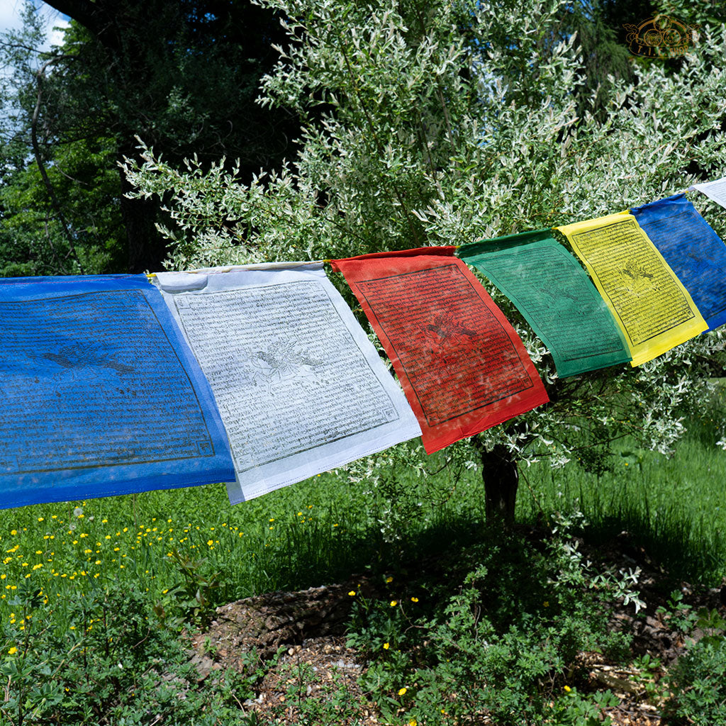 Close-up of colorful polyester Tibetan Windhorse prayer flag with traditional symbols for meditation and spiritual harmony