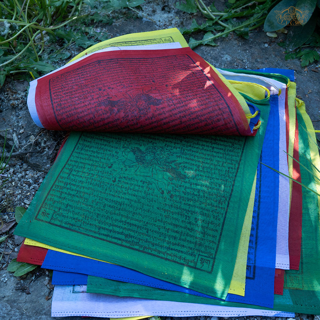 Long string of 25 hand-printed Windhorse prayer flags, each 28x30 cm, used for spiritual protection, luck, and meditation