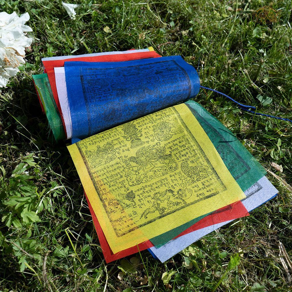 Close-up of colorful polyester Tibetan Windhorse prayer flag with traditional symbols for meditation and protection