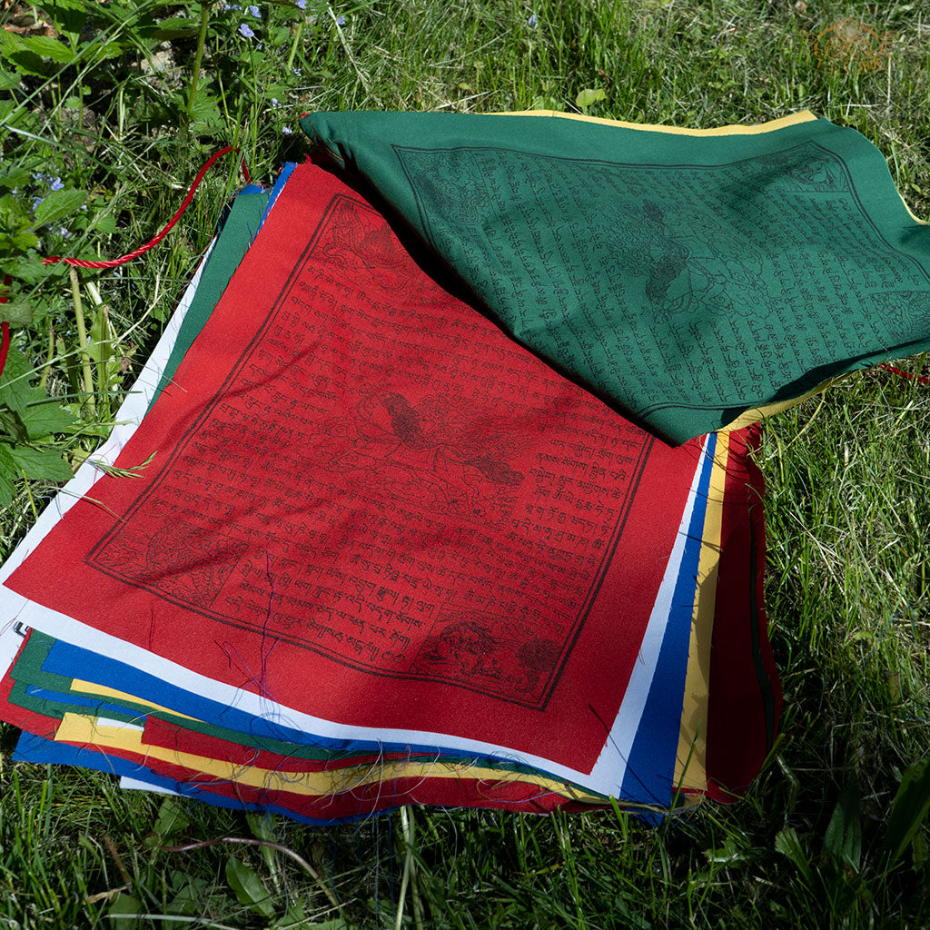 Close-up of colorful cotton Tibetan Windhorse prayer flag with traditional symbols for protection and positive energy
