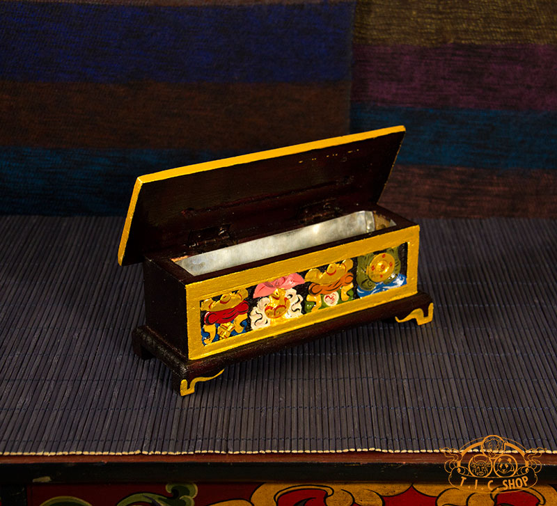 Top view of Tibetan incense burner box with lid opened, showing metal liner inside.