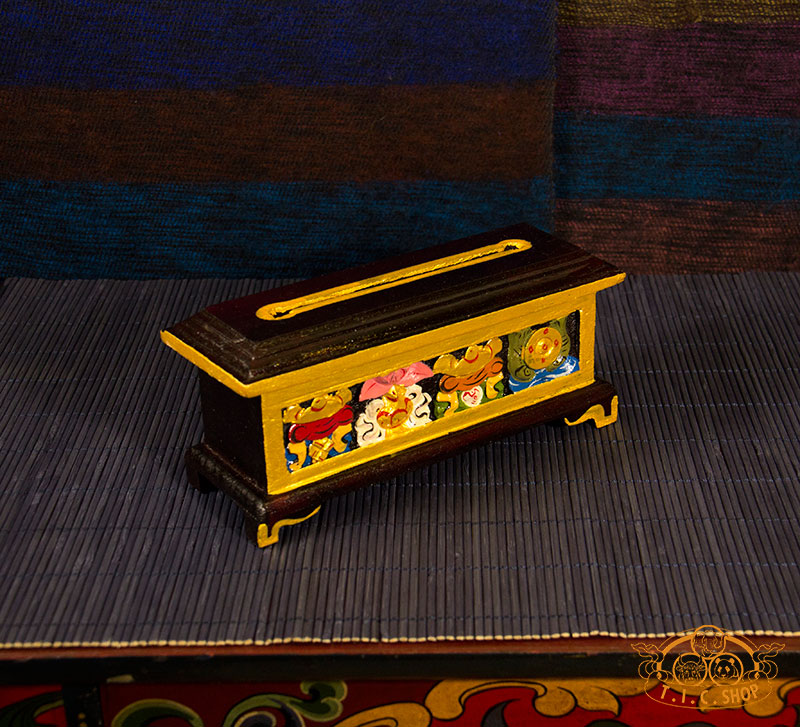 Side view of hand-painted wooden incense burner box for Tibetan incense sticks and powder.