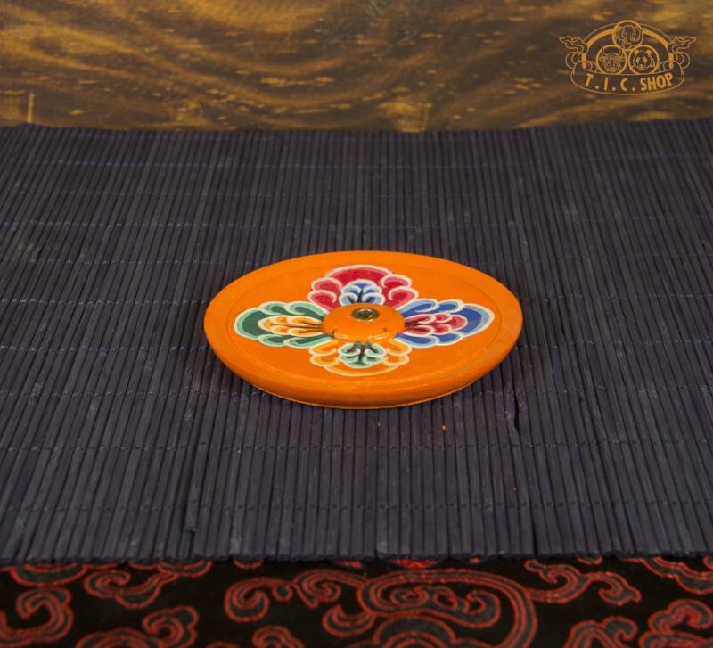 Side view of hand-carved Tibetan incense burner box for Tibetan and Indian incense sticks.

