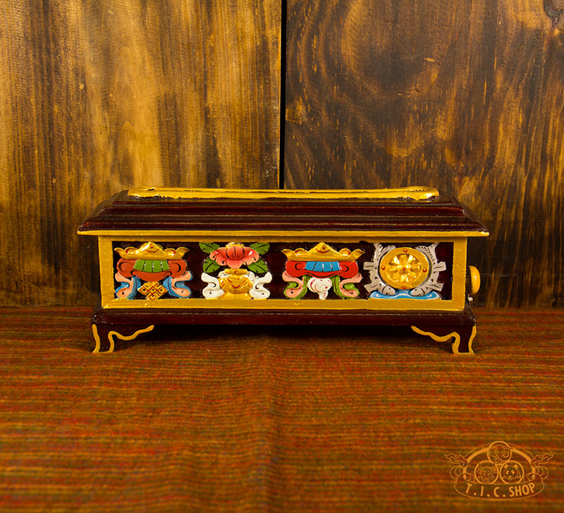 Front view of Tibetan wooden incense burner box hand-carved and painted with 8 Auspicious Symbols, featuring a narrow smoke opening.